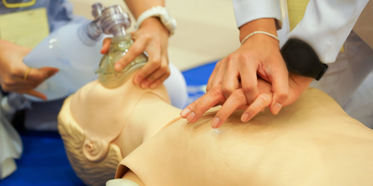 Chest compression and ambubag ventilation during CPR training with a doll