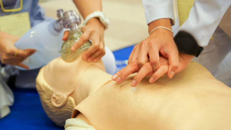 Chest compression and ambubag ventilation during CPR training with a doll Chest compression and ambubag ventilation during CPR training with a doll